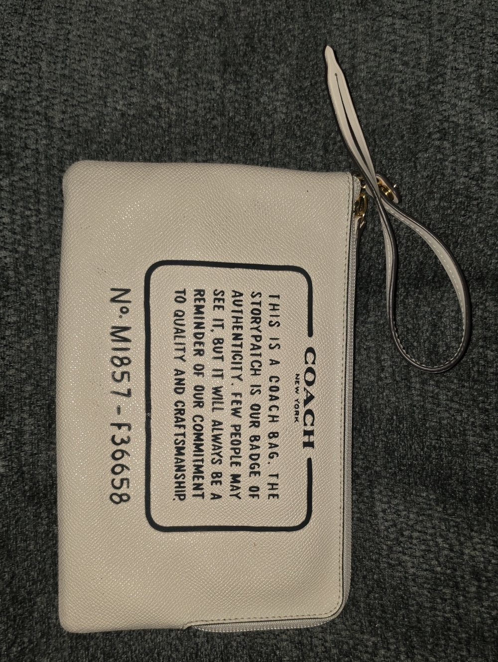 Coach Cream Wristlet with Black Logo Patch Print